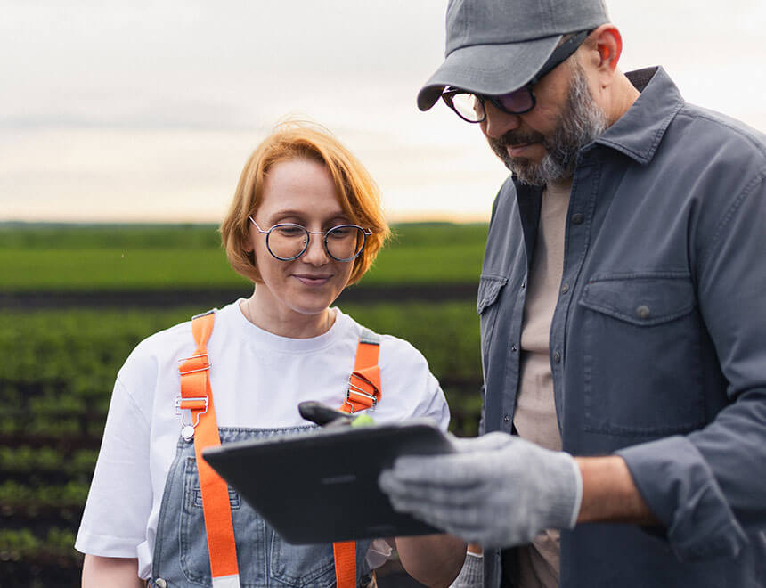 leadity ISO and ESG innovation showcase summer 2026 FLAG emissions, photo: Female and male farmers in a green field looking at a tablet