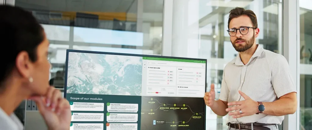 ISO 14001 – A woman and a man discuss an environmental management system